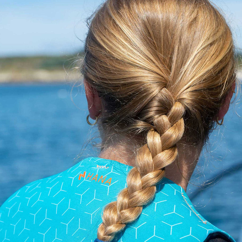 HANA Neo Vest 50 N life jacket, Light Blue – back view, worn by a woman
