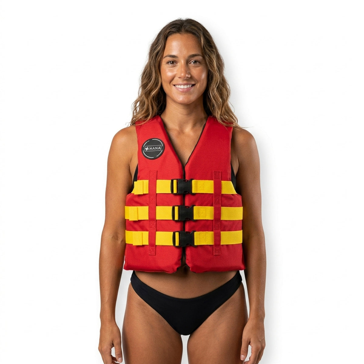 Woman wearing the red HANA Rental Vest 50 N with yellow straps, front view