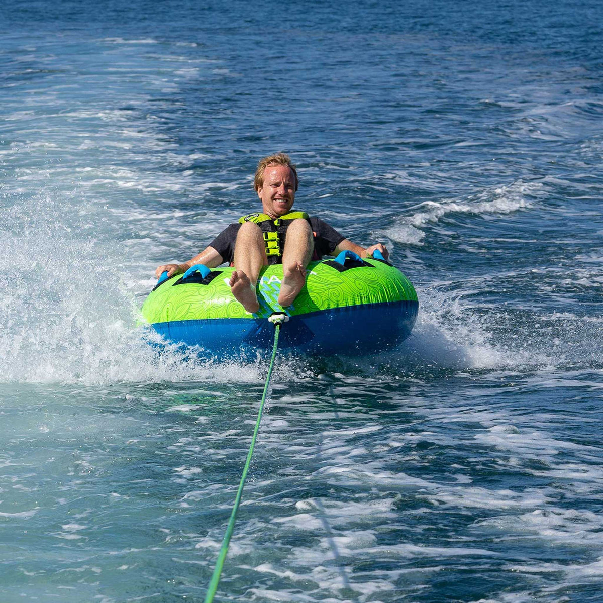 HANA Fishburger towable tube – rider being towed at sea