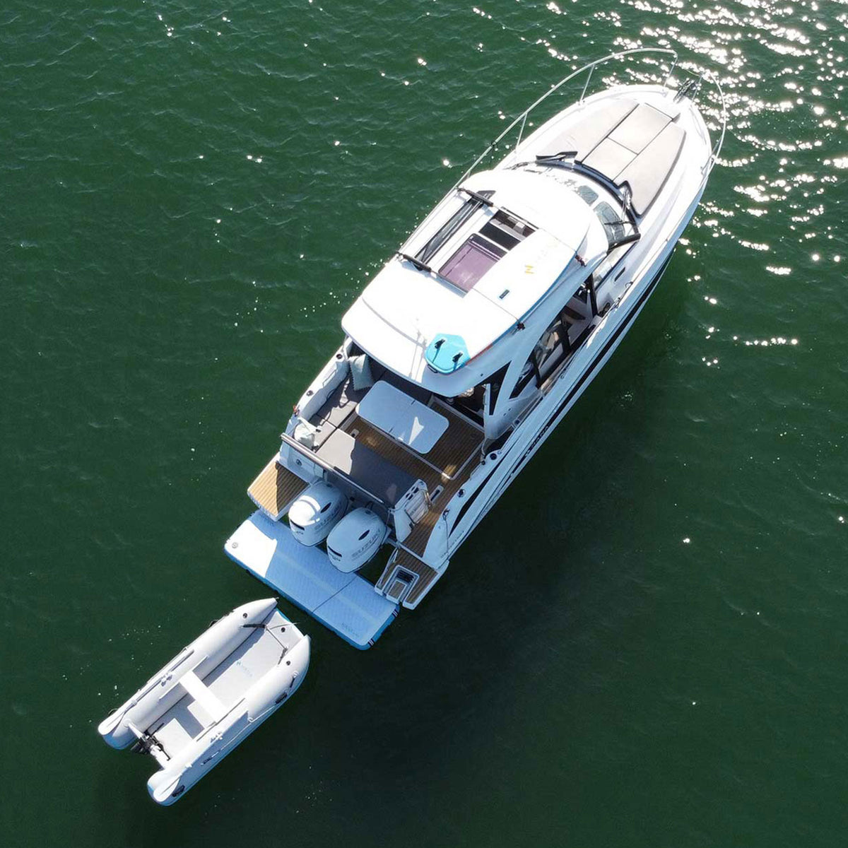 HANA Manta 249 inflatable tender – towed behind a yacht, aerial view