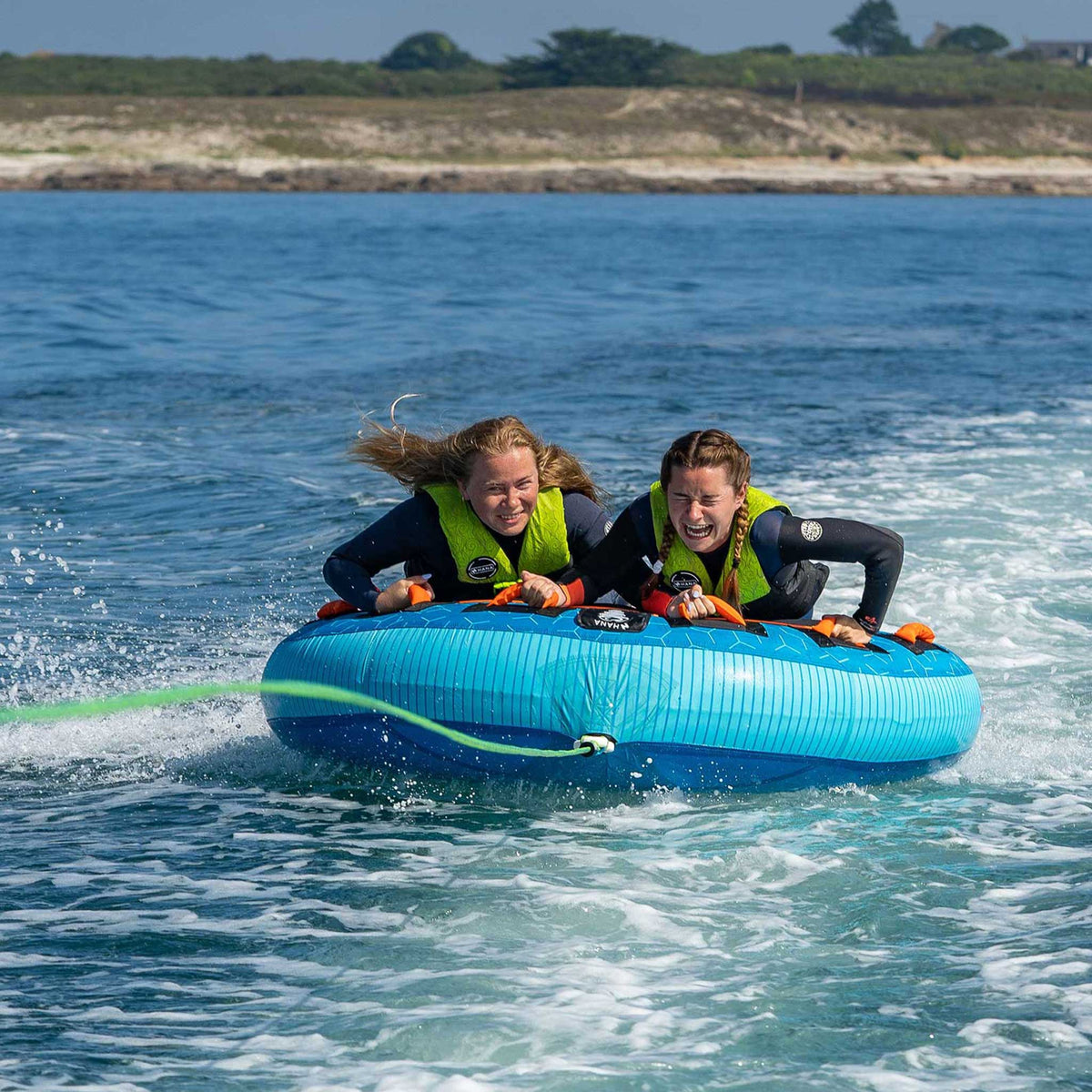 HANA Moon towable tube – riders being towed near the coast