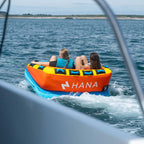 HANA Nemo towable tube – two riders being towed at sea