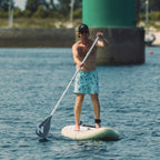Man stand up paddling with the white HANA Premium paddle