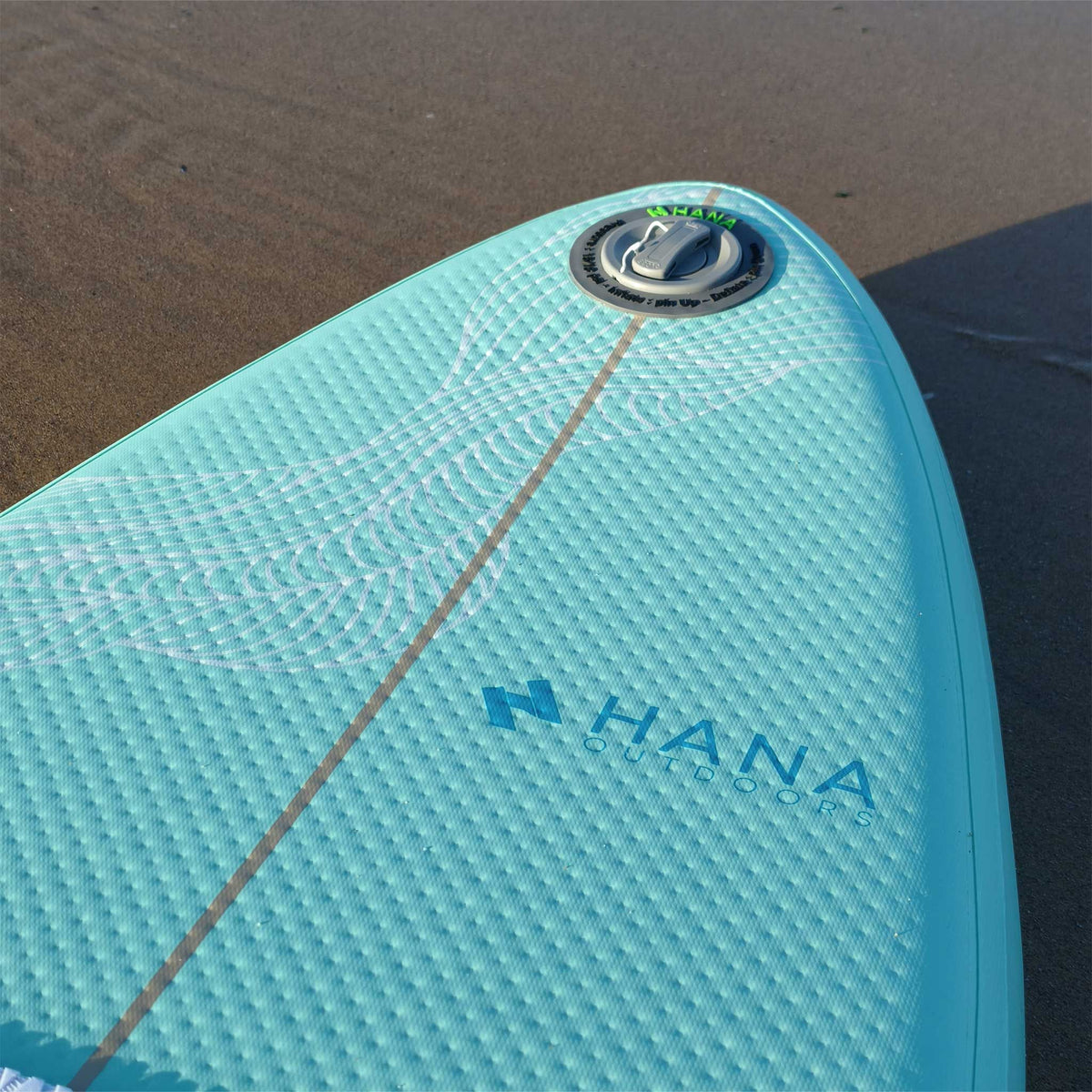 Close-up of the HANA Premium inflatable surfboard nose and valve