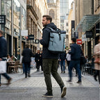 Man wearing the HANA XPlorer 25L backpack in Graphite Blue in the city